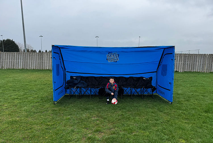 Team member inside the portable shelter
